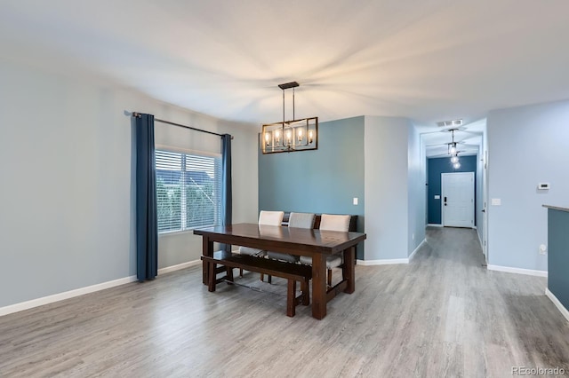 449 Vista Blvd, Lochbuie, CO 80603 - dining area with wood finished floors and a chandelier