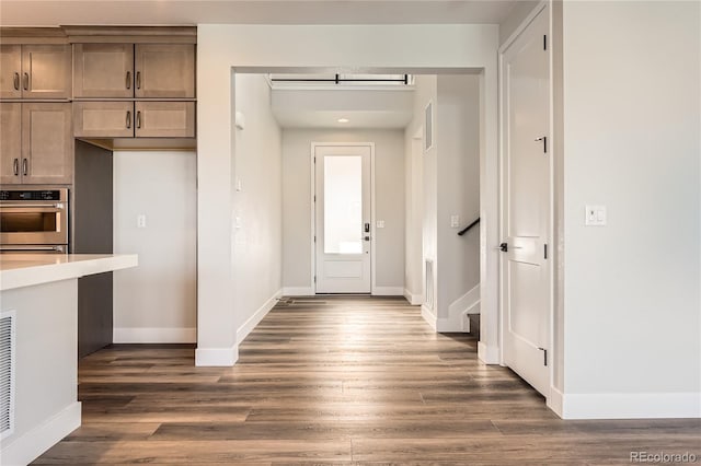 kitchen featuring dark hardwood / wood-style floors and stainless steel oven