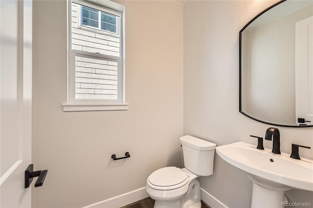 bathroom with toilet and sink