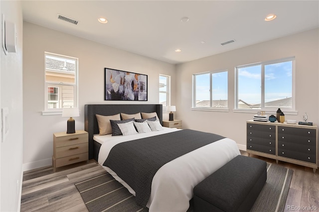 bedroom with hardwood / wood-style floors