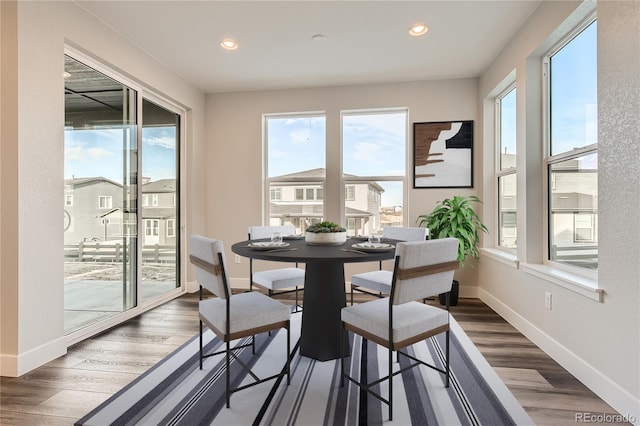 dining space featuring dark hardwood / wood-style floors