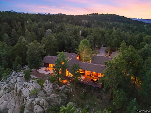 28550 Cavan Ln, Evergreen, CO 80439 - aerial view at dusk of a view of trees and a mountain view