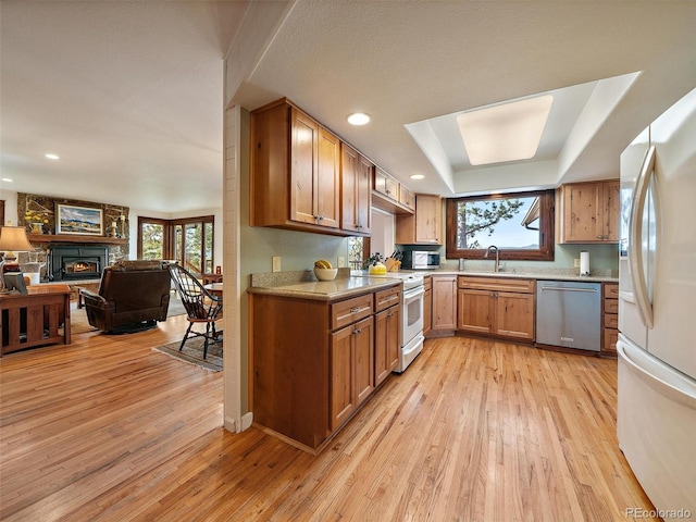28550 Cavan Ln, Evergreen, CO 80439 - kitchen featuring appliances with stainless steel finishes, light wood-style flooring, plenty of natural light, and recessed lighting