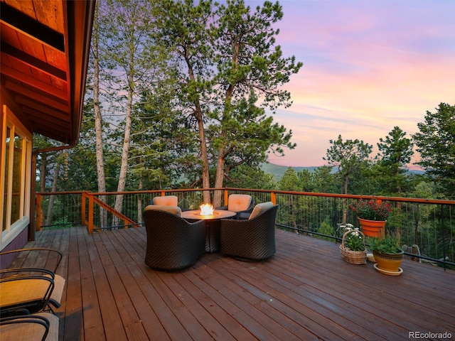 28550 Cavan Ln, Evergreen, CO 80439 - wooden deck with an outdoor fire pit