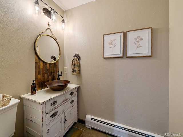 28550 Cavan Ln, Evergreen, CO 80439 - half bath featuring a baseboard heating unit and vanity