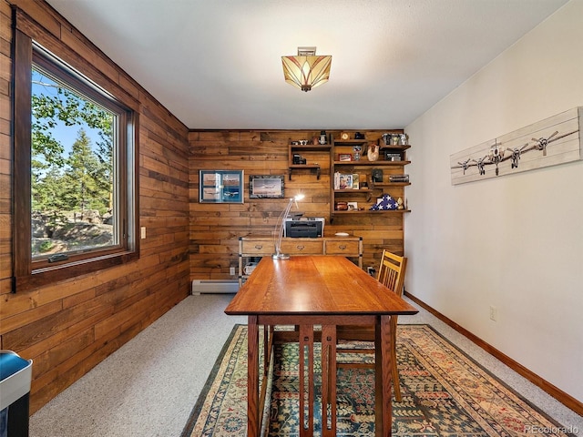 28550 Cavan Ln, Evergreen, CO 80439 - carpeted dining area with wood walls and a baseboard radiator