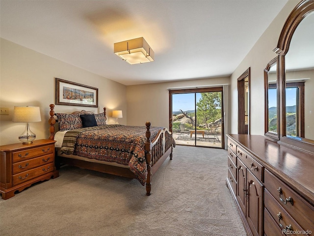 28550 Cavan Ln, Evergreen, CO 80439 - bedroom with light colored carpet and access to exterior