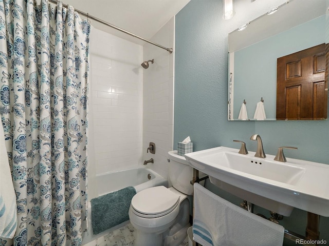 28550 Cavan Ln, Evergreen, CO 80439 - bathroom featuring shower / bath combination with curtain and a textured wall