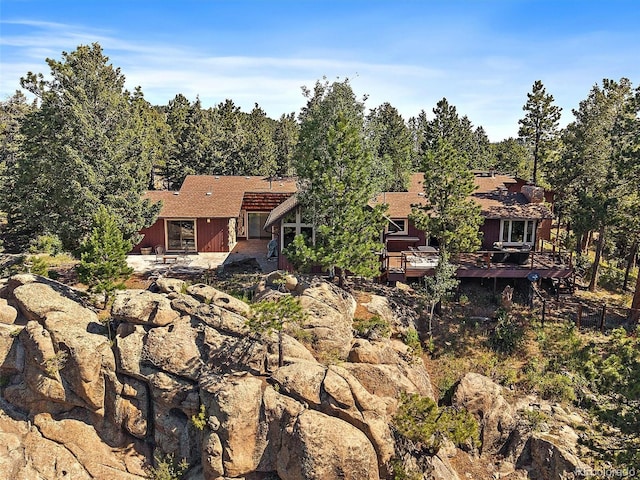 28550 Cavan Ln, Evergreen, CO 80439 - back of property featuring a deck and a patio