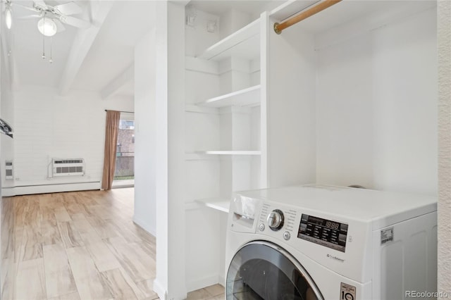 laundry area with washer / dryer, a wall mounted AC, ceiling fan, and baseboard heating