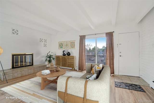 250 N Pearl St Unit 310, Denver, CO 80203 - living area featuring beamed ceiling, a fireplace, and wood finished floors