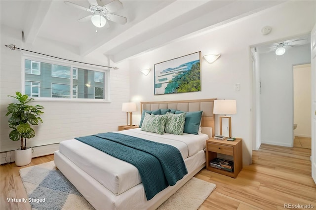 250 N Pearl St Unit 310, Denver, CO 80203 - bedroom featuring beamed ceiling, wood finished floors, and a ceiling fan