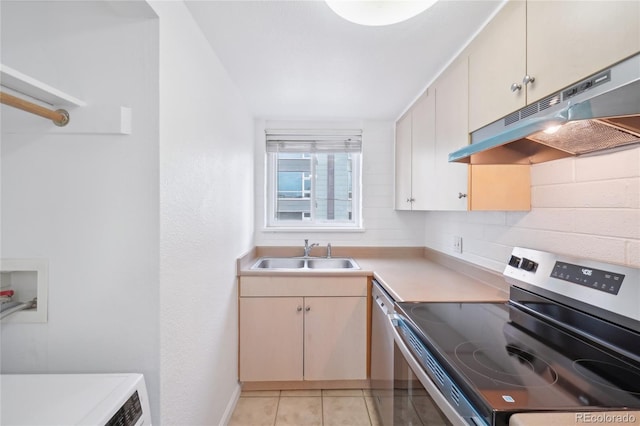 250 N Pearl St Unit 310, Denver, CO 80203 - kitchen with stainless steel appliances, under cabinet range hood, light countertops, and light tile patterned floors