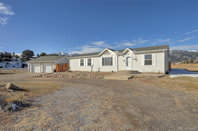 manufactured / mobile home featuring a garage and a mountain view