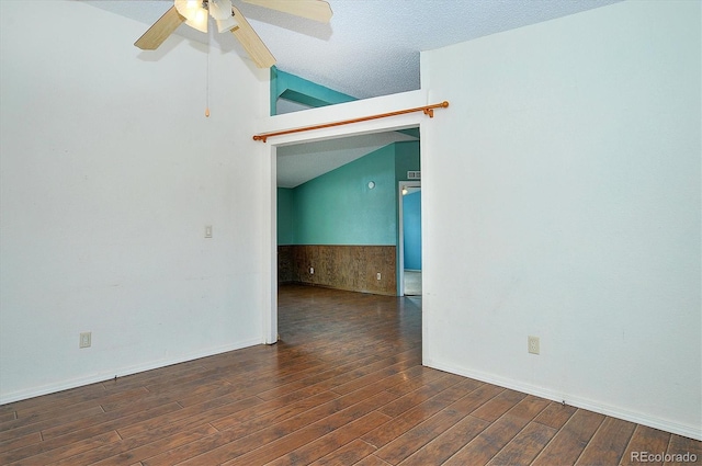 unfurnished room with lofted ceiling, dark wood-type flooring, and ceiling fan