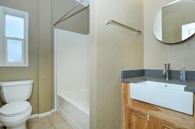 full bathroom with vanity, toilet, tile patterned flooring, and shower / bathing tub combination