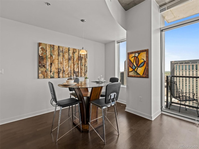 891 14th St Unit 3411, Denver, CO 80202 - dining area featuring dark wood-style floors and baseboards