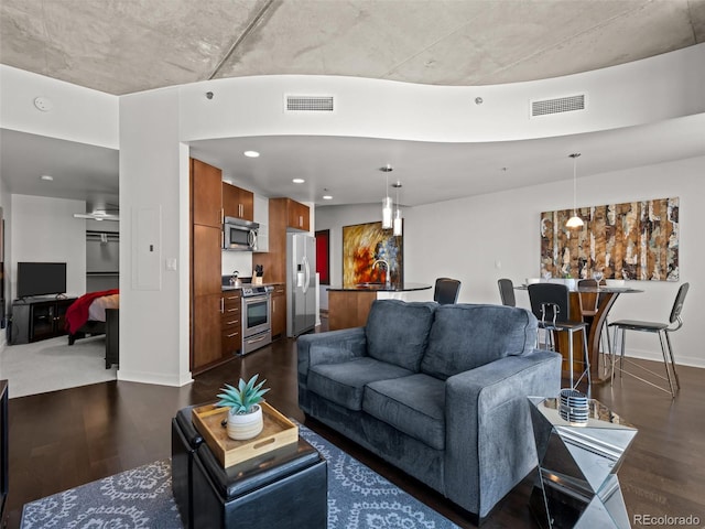 891 14th St Unit 3411, Denver, CO 80202 - living area featuring dark wood-type flooring, baseboards, and recessed lighting