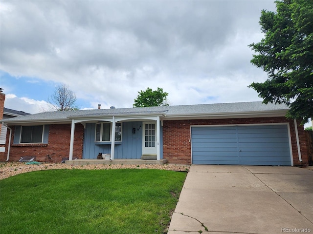912 S Kingston St, Aurora, CO 80012 - ranch-style home featuring driveway, an attached garage, a front lawn, a porch, and board and batten siding