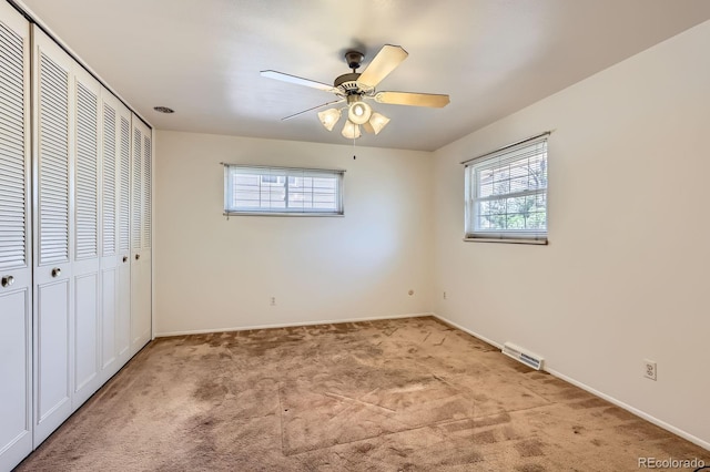 912 S Kingston St, Aurora, CO 80012 - unfurnished bedroom featuring light carpet, a closet, and baseboards