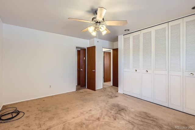 912 S Kingston St, Aurora, CO 80012 - unfurnished bedroom featuring light colored carpet, a closet, baseboards, and ceiling fan