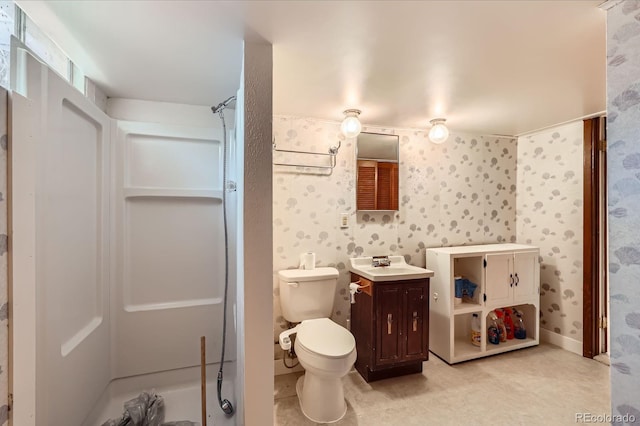 912 S Kingston St, Aurora, CO 80012 - full bathroom featuring a shower, vanity, toilet, and wallpapered walls
