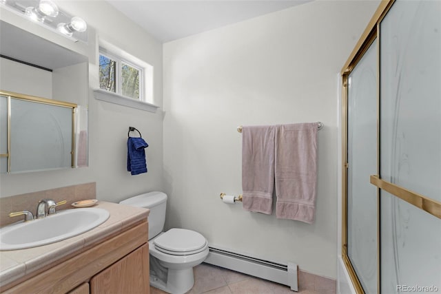 full bathroom with baseboard heating, tile patterned flooring, toilet, combined bath / shower with glass door, and vanity