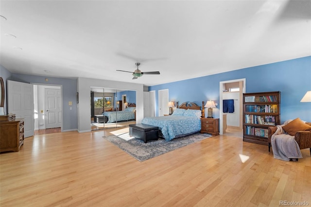 bedroom with ceiling fan and light hardwood / wood-style flooring