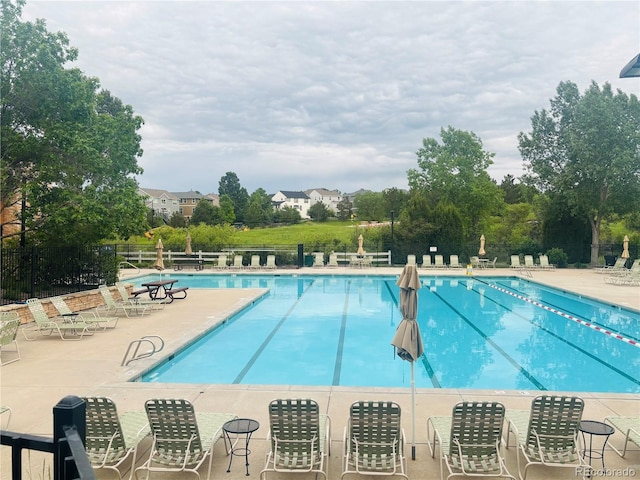 8114 Briar Ridge Dr, Castle Pines, CO 80108 - community pool with a patio