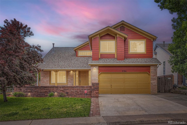 5784 W 81st Cir, Arvada, CO 80003 - view of front of house with an attached garage, concrete driveway, brick siding, and roof with shingles