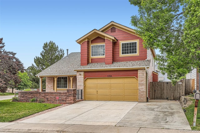 5784 W 81st Cir, Arvada, CO 80003 - view of front of house with brick siding, an attached garage, roof with shingles, and concrete driveway