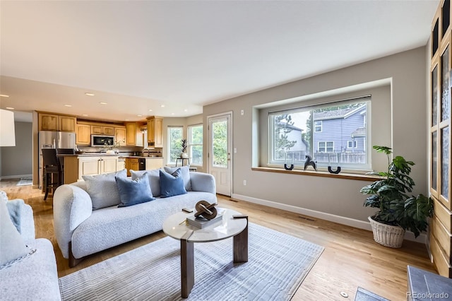5784 W 81st Cir, Arvada, CO 80003 - living area featuring recessed lighting, baseboards, and light wood-style floors