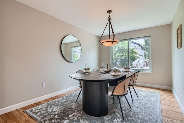 5784 W 81st Cir, Arvada, CO 80003 - dining area with baseboards and light wood-style flooring