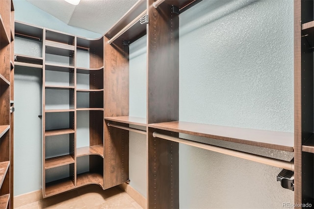 5784 W 81st Cir, Arvada, CO 80003 - spacious closet featuring tile patterned floors