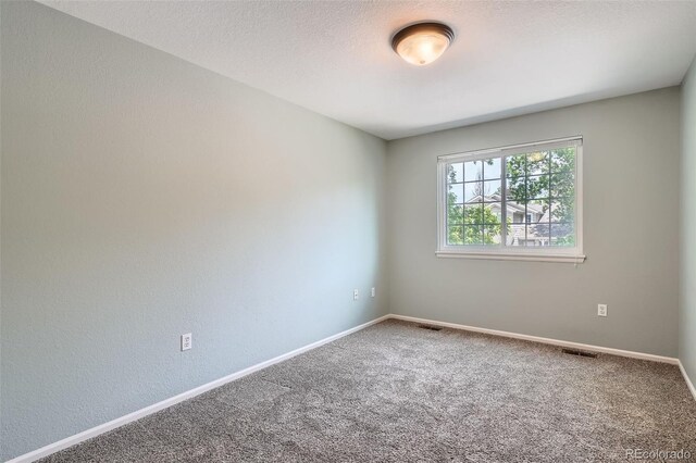 5784 W 81st Cir, Arvada, CO 80003 - carpeted spare room featuring baseboards