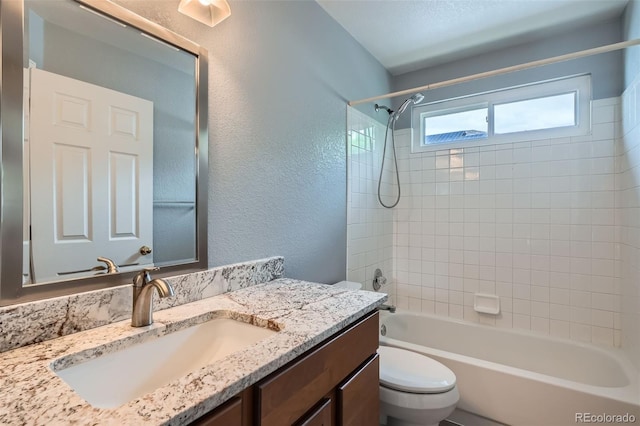 5784 W 81st Cir, Arvada, CO 80003 - full bathroom with toilet, vanity, shower / bath combination, and a textured wall