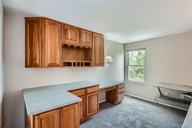 5784 W 81st Cir, Arvada, CO 80003 - unfurnished office with built in desk, baseboards, and light carpet