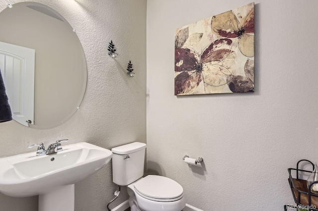 bathroom with toilet and sink