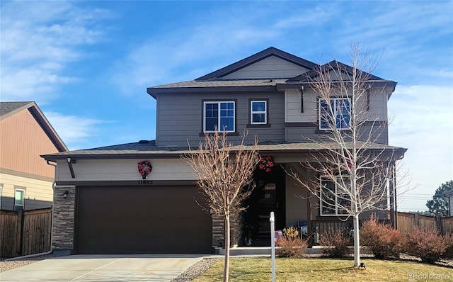 view of front facade featuring a garage and a front lawn