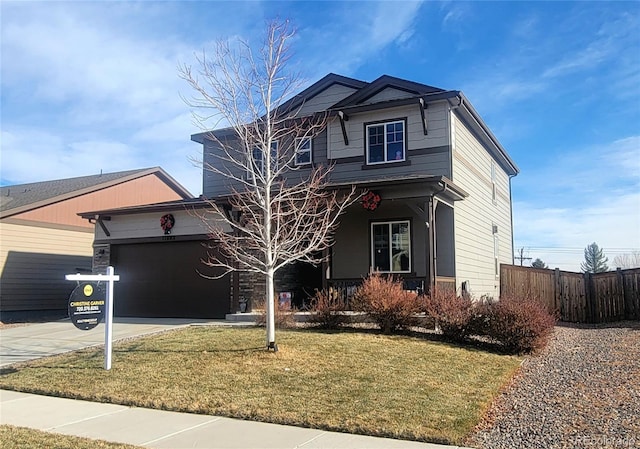 view of front facade with a front lawn and a garage