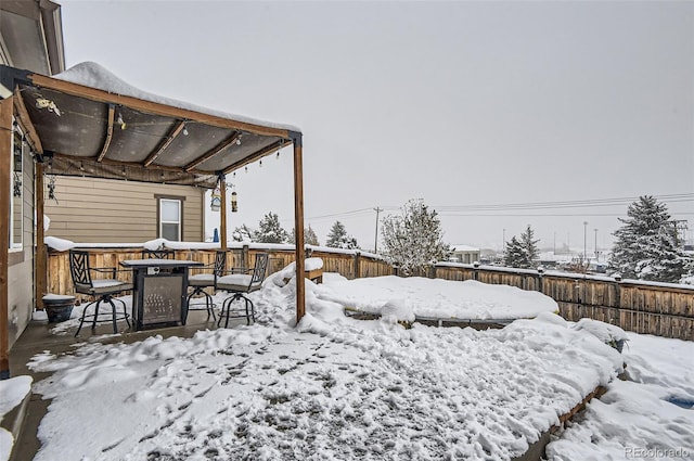 view of yard layered in snow