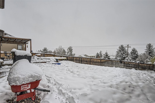 view of yard layered in snow