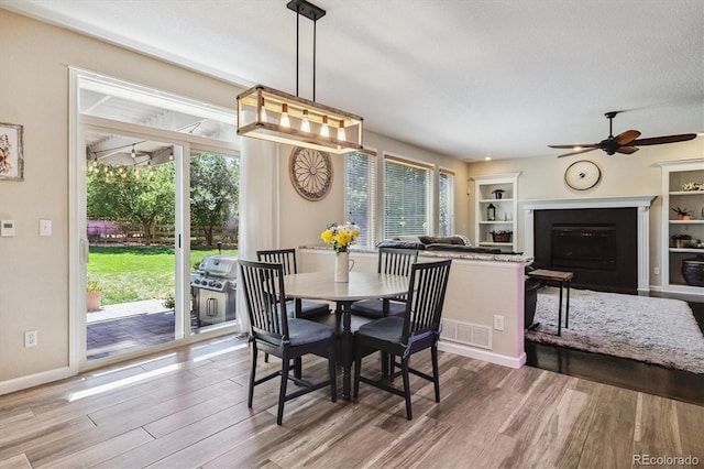 16498 E Lake Dr, Centennial, CO 80016 - dining area with healthy amount of natural light, wood finished floors, and ceiling fan