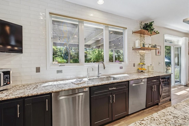 16498 E Lake Dr, Centennial, CO 80016 - kitchen with wine cooler, appliances with stainless steel finishes, tasteful backsplash, light stone counters, and open shelves
