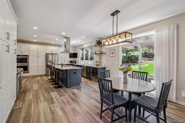 16498 E Lake Dr, Centennial, CO 80016 - dining room with light wood-style floors, recessed lighting, and wine cooler