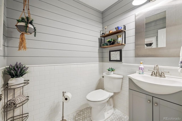 16498 E Lake Dr, Centennial, CO 80016 - bathroom with vanity, tile patterned flooring, and a wainscoted wall