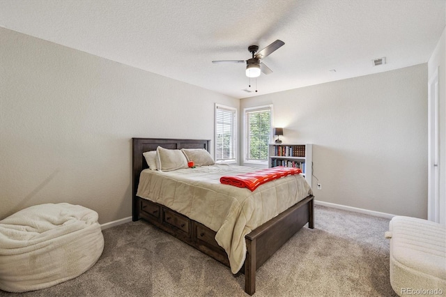 16498 E Lake Dr, Centennial, CO 80016 - bedroom featuring light colored carpet, ceiling fan, and a textured ceiling