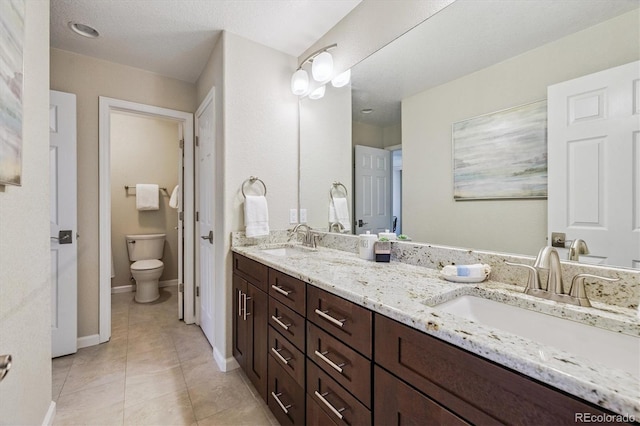 16498 E Lake Dr, Centennial, CO 80016 - bathroom featuring double vanity and tile patterned flooring
