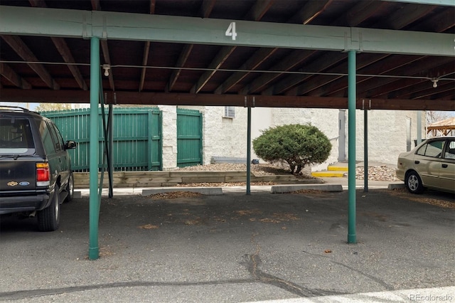 7770 W 38th Ave Unit 108, Wheat Ridge, CO 80033 - covered parking lot with fence