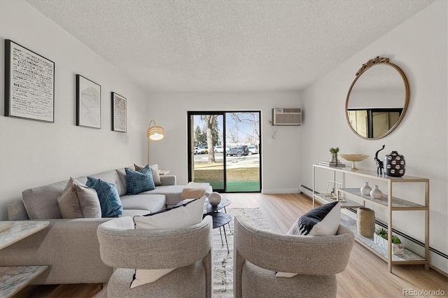 7770 W 38th Ave Unit 108, Wheat Ridge, CO 80033 - living room featuring baseboard heating, an AC wall unit, a textured ceiling, and wood finished floors